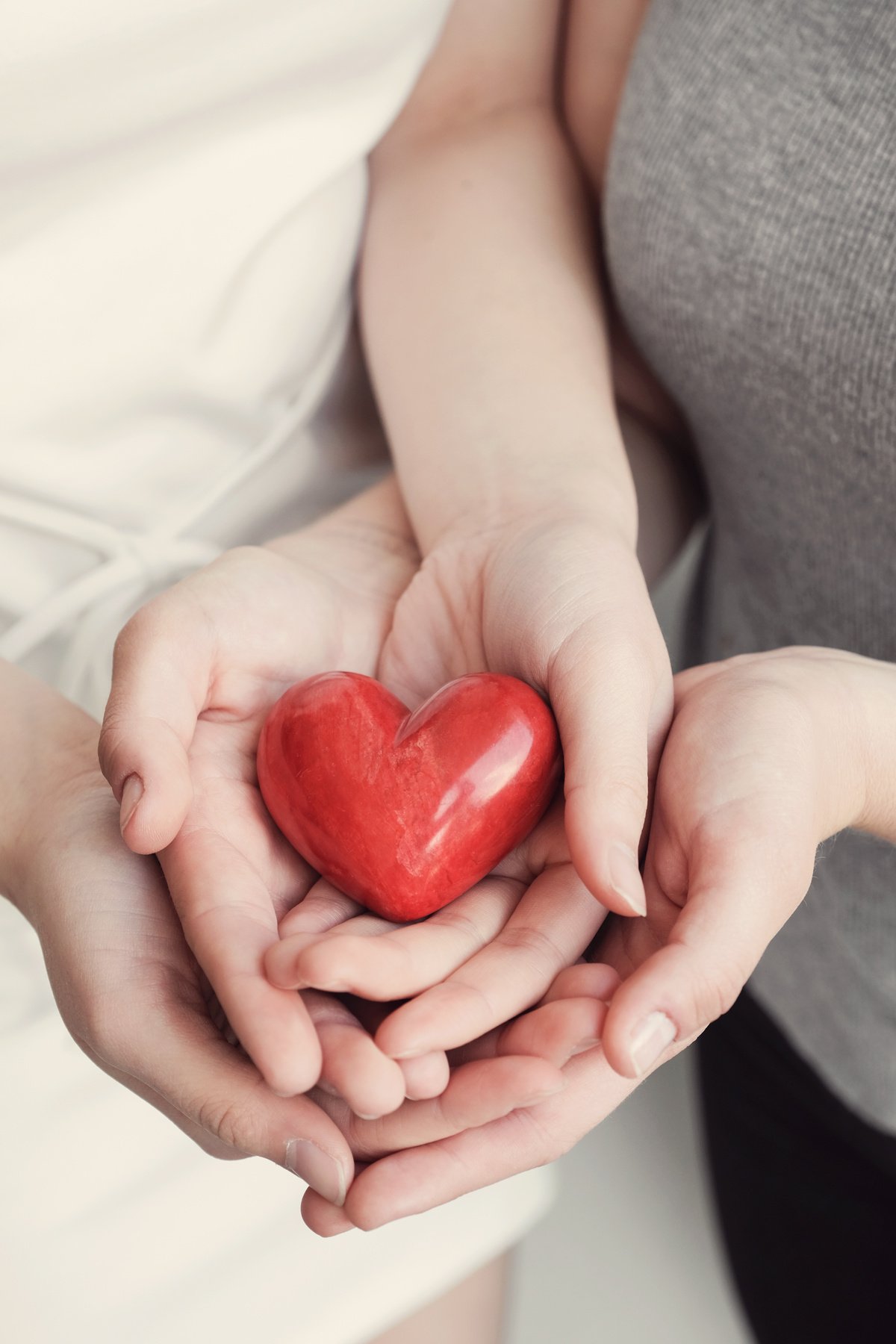 Young women holding red heart, health insurance, donation concept